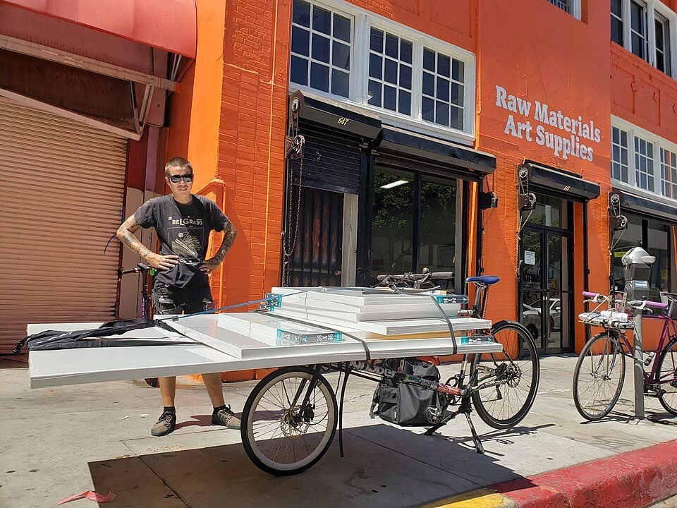 Courier loading a cargo bike